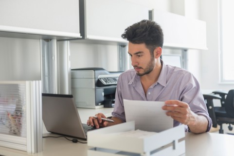 Businessman at work in office.