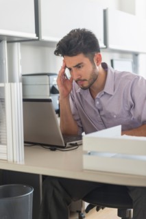 Businessman at work in office.