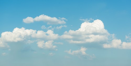Puffy clouds on blue sky.