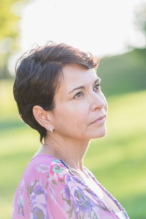 Portrait of mature woman outdoors.