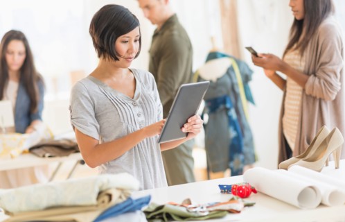 Young fashion designers working in studio.