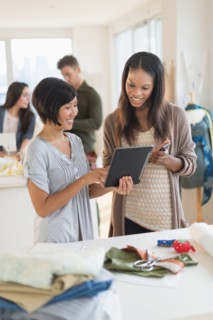 People working in fashion studio.