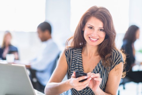 Smiling woman in office.