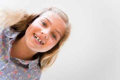 Portrait of smiling blonde girl (8-9)