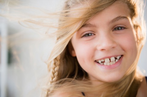 Portrait of smiling blonde girl (8-9)