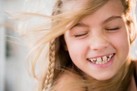 Portrait of smiling blonde girl (8-9)