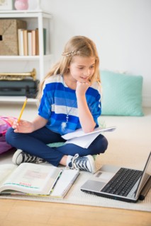 Girl (8-9) doing homework