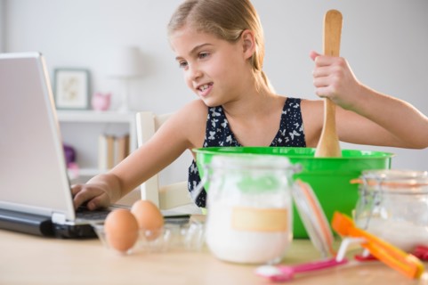 View of girl (8-9) baking