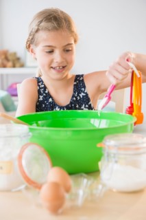 View of girl (8-9) baking