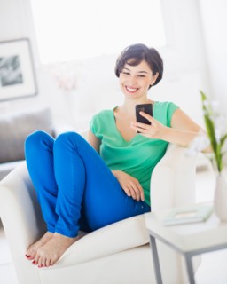 Portrait of young woman using mobile phone