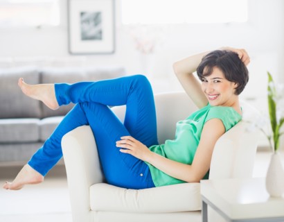 Portrait of cheerful woman relaxing at home