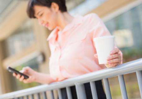 Portrait of business woman text messaging