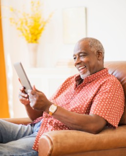 Portrait of men using digital tablet