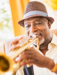 Portrait of man playing trumpet