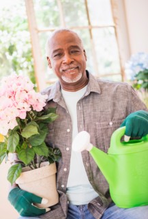 Portrait of man working in greenhouse