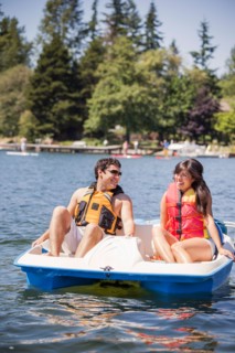 Young man and woman on paddle boat
