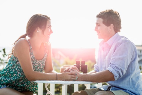 Side view of young man and woman looking at each other