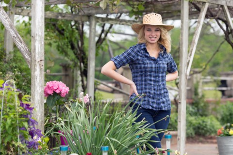 Portrait of young woman in garden
