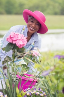 Portrait of senior woman working in garden