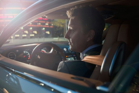 Businessman driving car