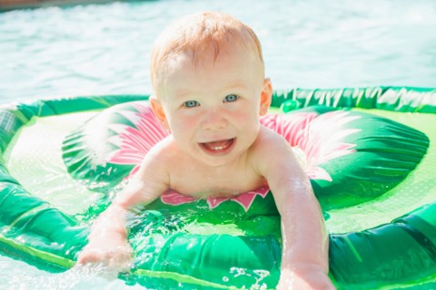 Baby Boy (18-23 months) playing in swimming pool