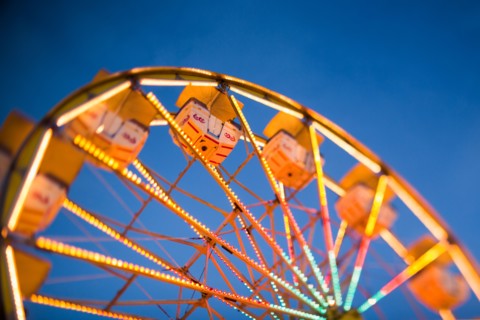 Ferris wheel in amusement park at dusk