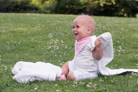 Baby (12-17 months) playing in park