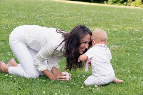 Mother and daughter (12-17 months) playing in park