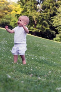 Baby (12-17 months) playing in park