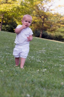 Baby (12-17 months) playing in park