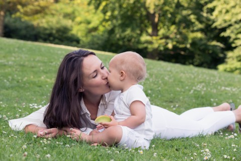 Mother and daughter (12-17 months) playing in park