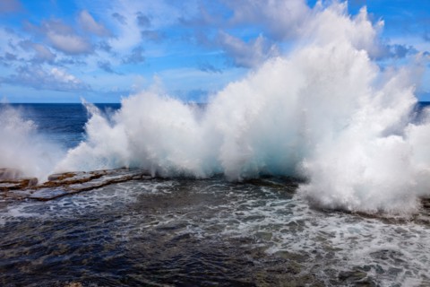 Wave crushing on rock