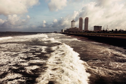 Waves of Indian Ocean and city skyline