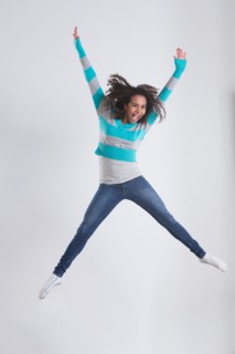 Studio Shot of girl (12-13) jumping