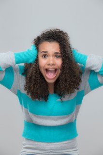 Portrait of girl (12-13) screaming