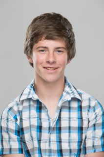 Portrait of teenage boy (14-15) smiling