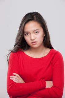 Portrait of teenage girl (16-17) with arms crossed