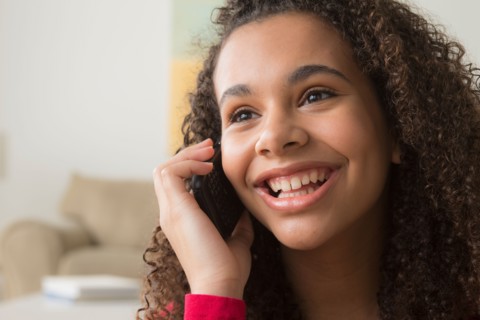 Portrait of girl (12-13) talking on her mobile