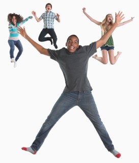 Studio shot of four friends (12-13,14-15) jumping on white background