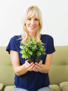 Woman holding potted plant