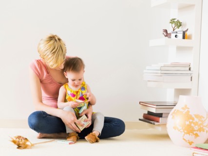 Mother playing with baby daughter (12-17 months)
