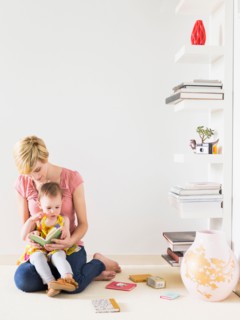 Mother playing with baby daughter (12-17 months)