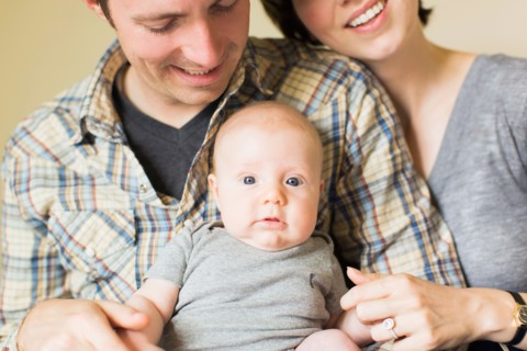 Portrait of parents with baby son (2-5 months)