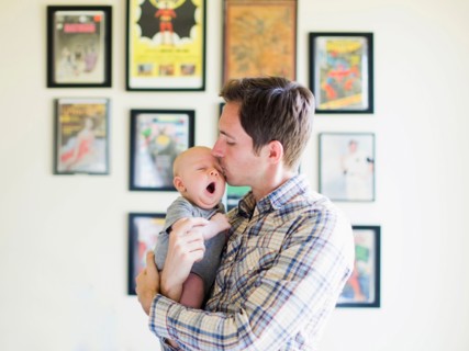 Father kissing baby son (2-5 months)