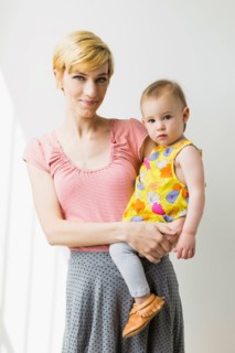 Portrait of mother holding daughter (12-17 months)