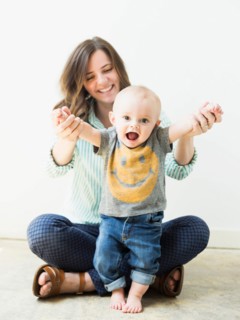 Studio portrait of mother holding baby boy (6-11 months)