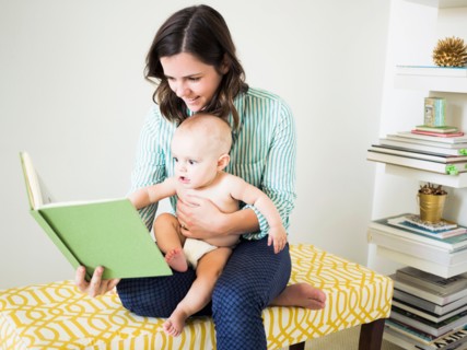 Mother with son (6-11 months) reading book