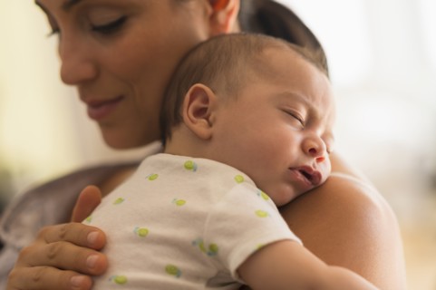 Mother holding baby (2-5 months).