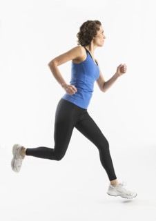 Studio shot of mature woman jogging.