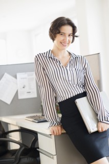 Portrait of business woman in office.
Photo : Jamie Grill